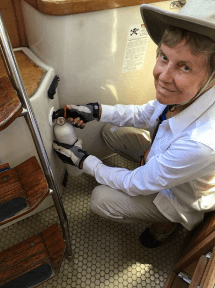 Betsy Lindsley demonstrating a fire port aboard Osprey