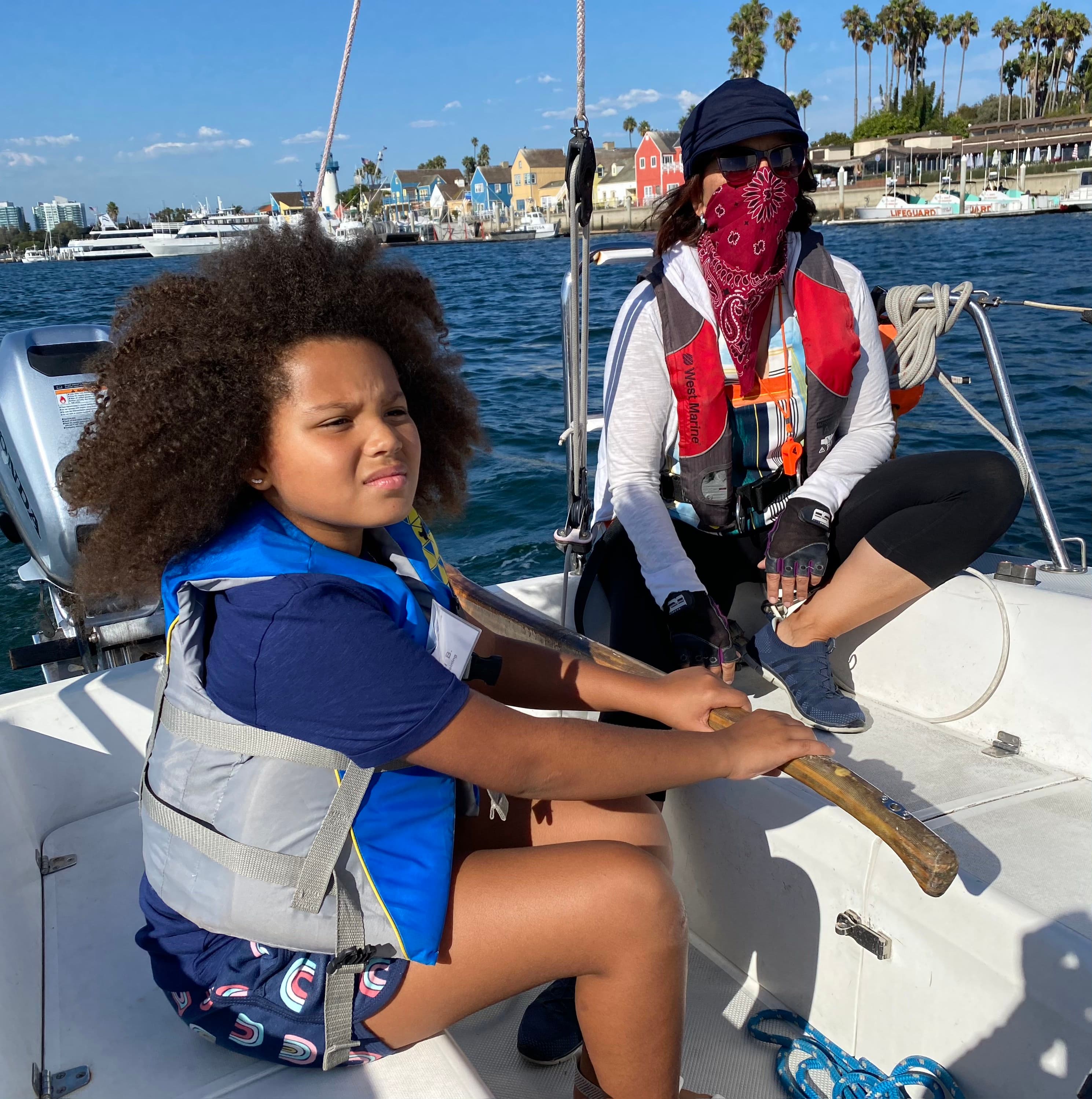 A young sailor at the helm