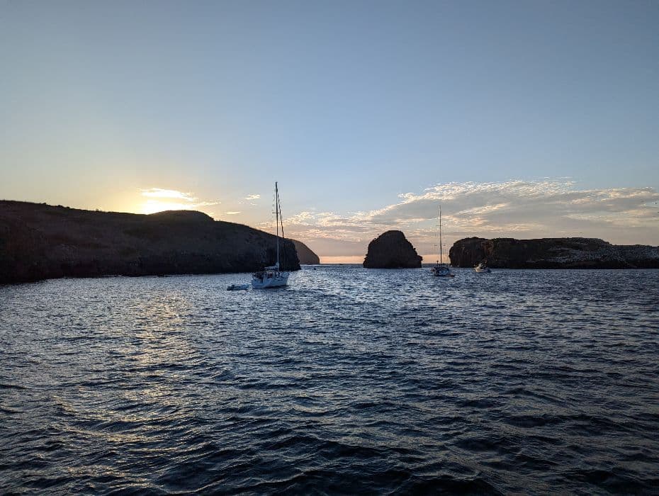 Fairwind boats anchored off Santa Cruz Island at sunset